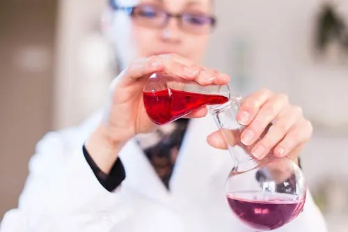 Scientist mixing chemicals