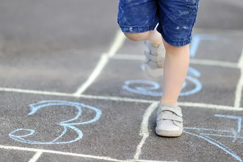 Child playing hopskotch